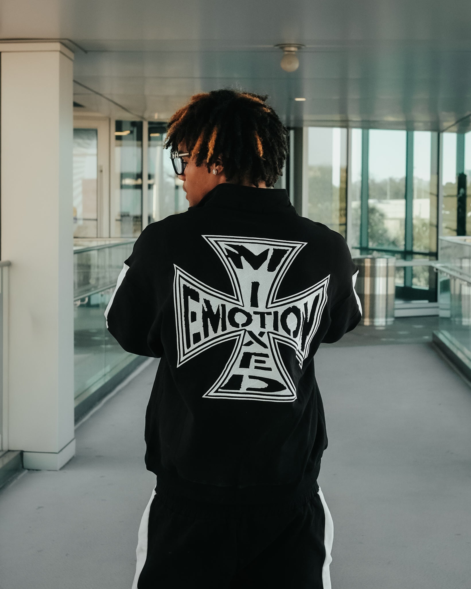 Black “Quarter” zip Jacket